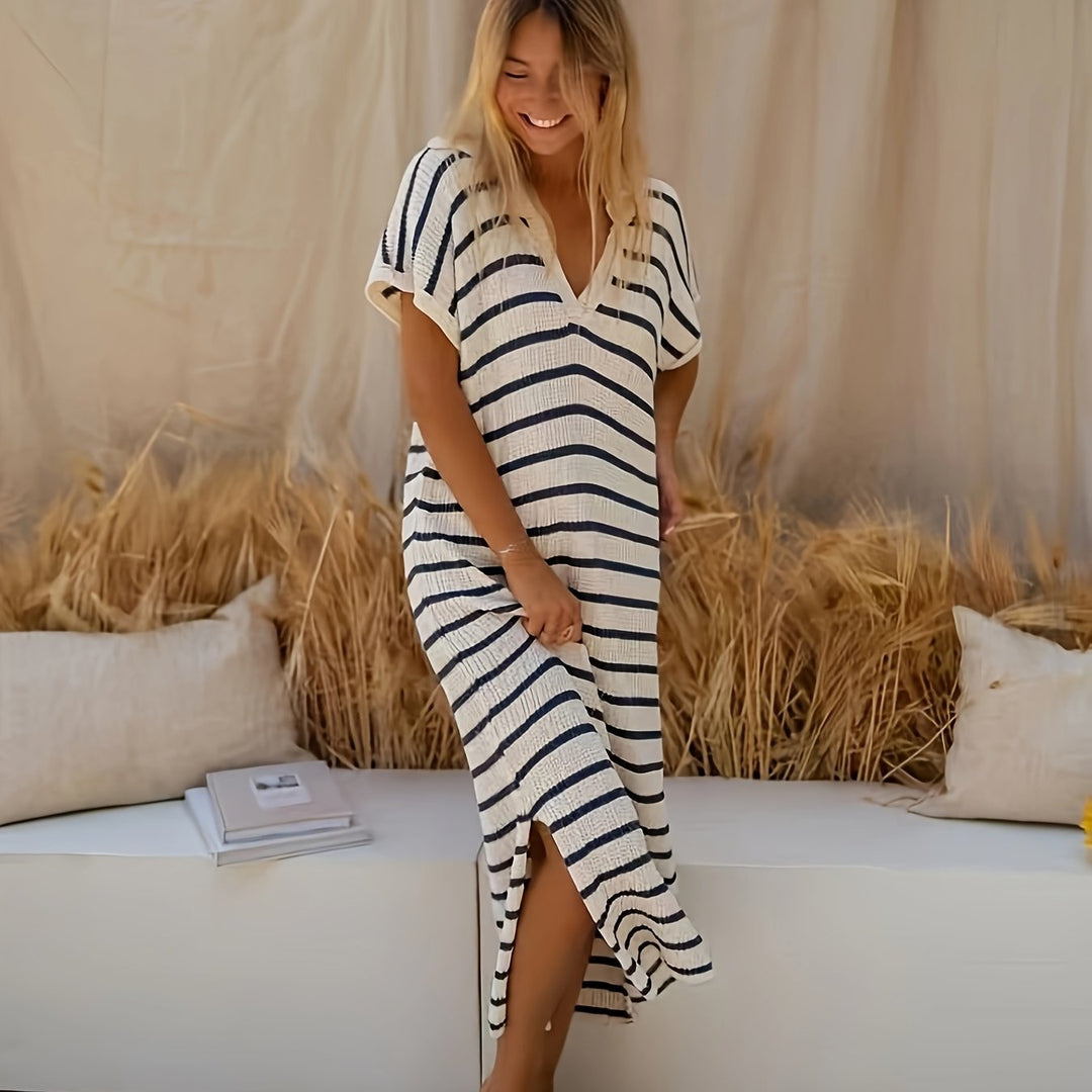 Abito midi da donna in maglia a righe con scollo a V, ideale per un look casual o elegante.