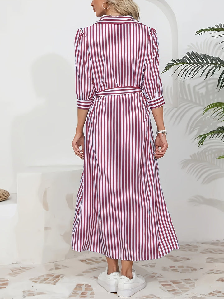 Abito midi a righe per donna con design chemisier, cintura in vita e maniche tre quarti. Eleganza quotidiana.