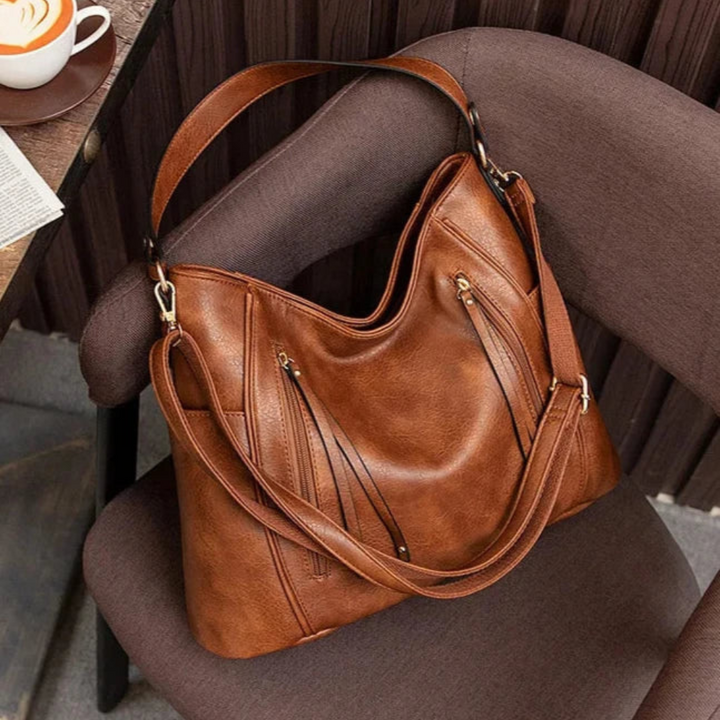 Borsa elegante effetto pelle grigia, design raffinato. Perfetta per l'ufficio o un evento speciale.