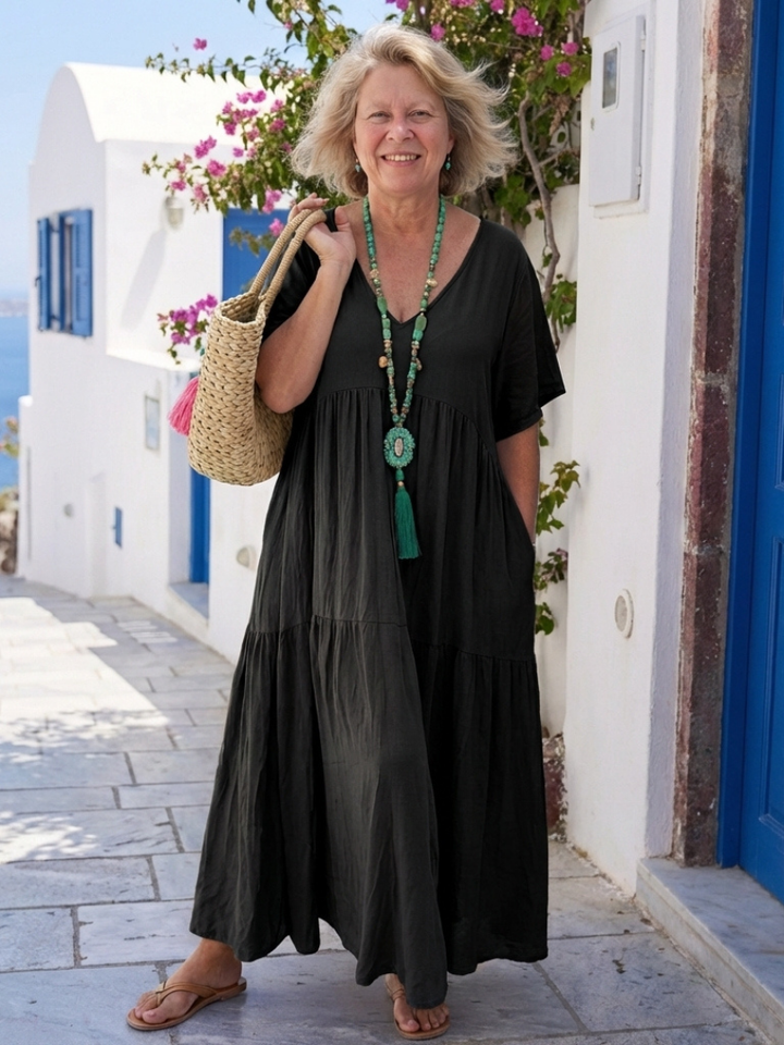 Abito da donna con balze decorative e maniche corte. Maxi dress femminile, versatile per look estivi e casual.