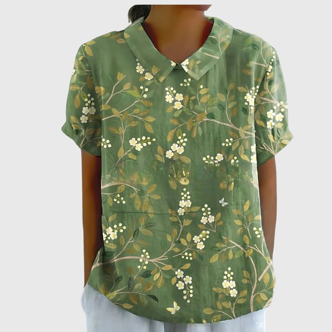 Blusa donna floreale moderna, elegante con colletto e maniche corte, un must-have per la bella stagione.