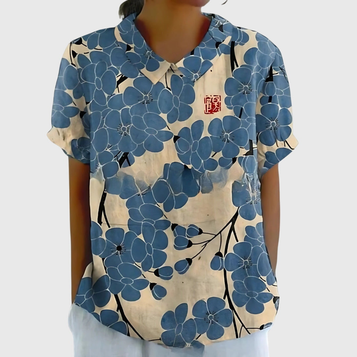 Blusa floreale donna con colletto e maniche corte, un classico elegante e comodo per ogni guardaroba.
