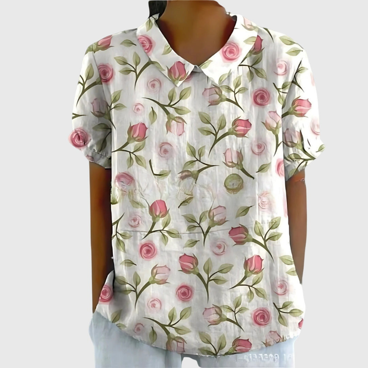 Blusa floreale donna in tessuto misto, con colletto e maniche corte, perfetta per look primaverili.