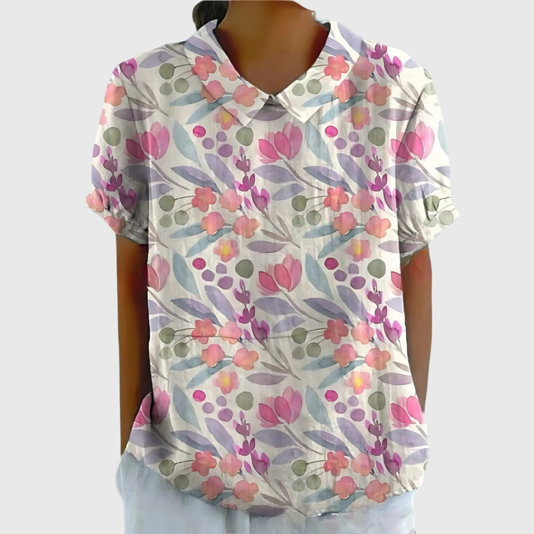 Blusa elegante floreale da donna con colletto e maniche corte, adatta per occasioni speciali o casual.