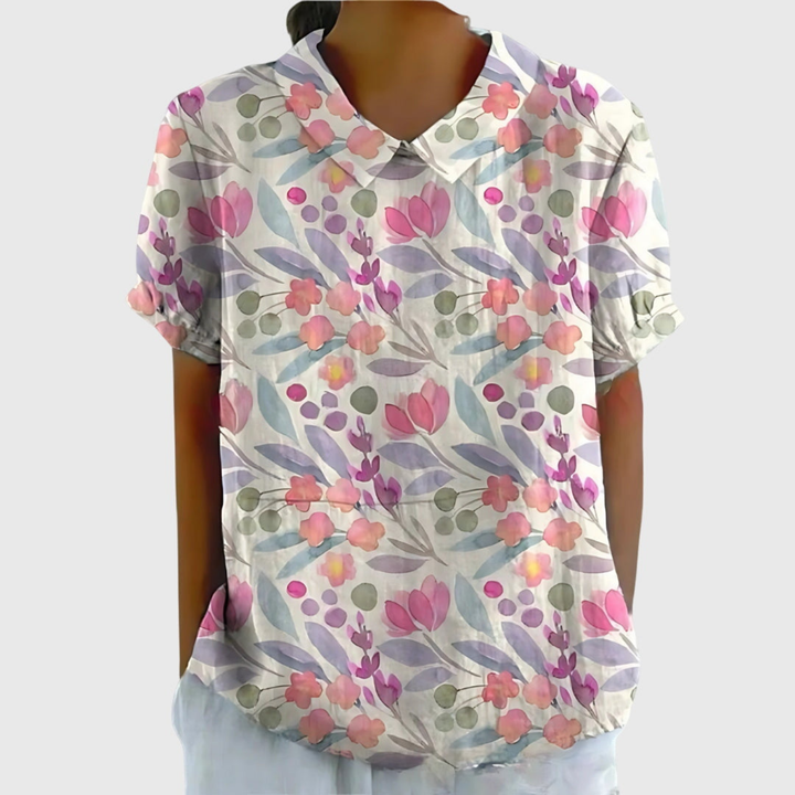 Blusa elegante floreale da donna con colletto e maniche corte, adatta per occasioni speciali o casual.
