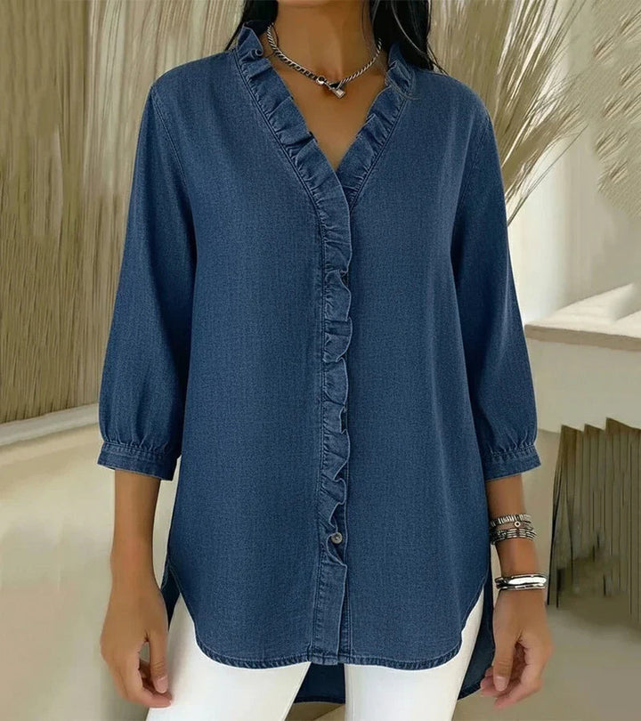 Blusa donna elegante con scollo a V, ruches e maniche a ¾. Perfetta per ufficio e casual.