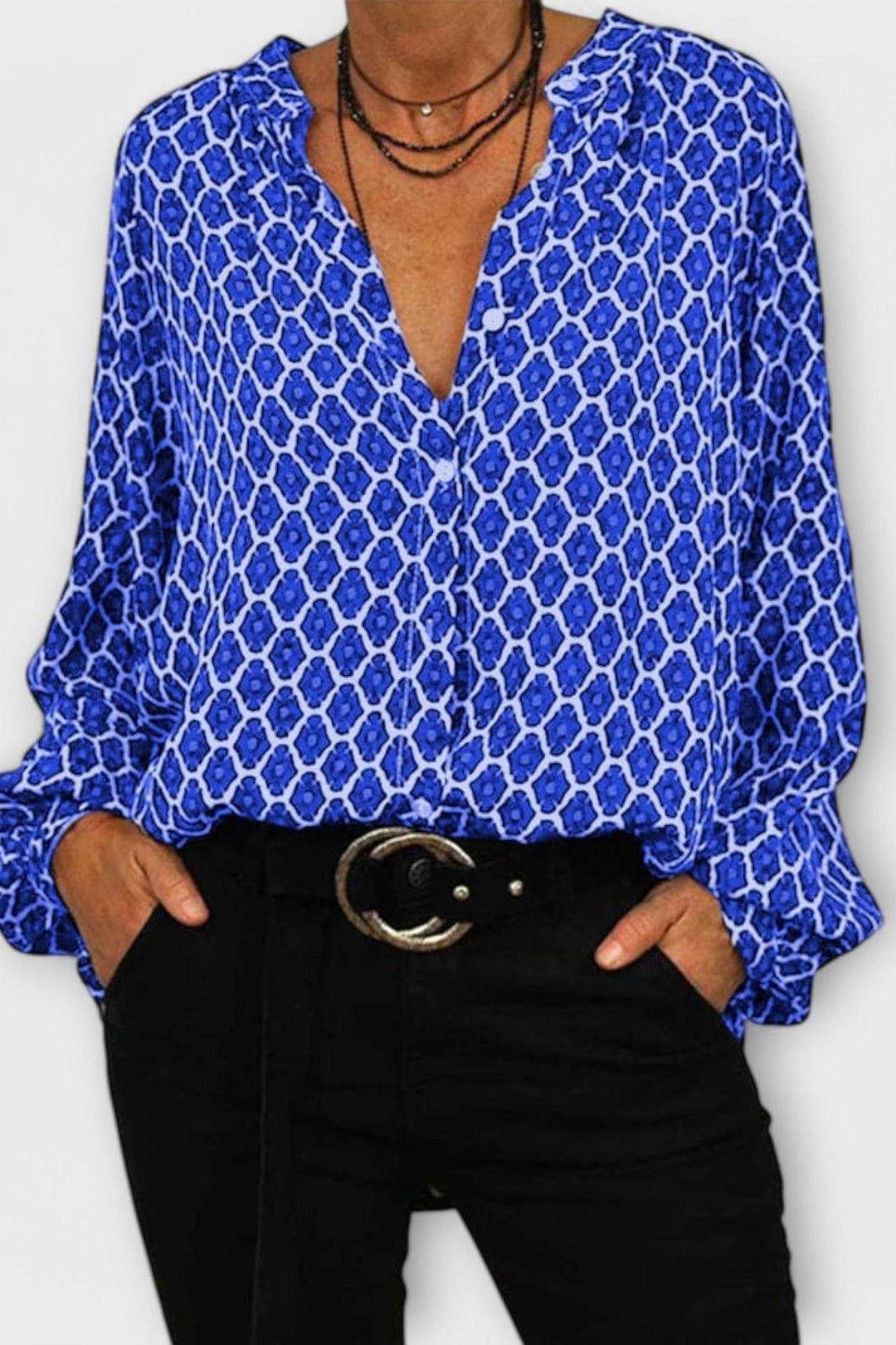 Moda donna: top con scollo a V e maniche lunghe, fantasia geometrica moderna, disponibile in nero, rosso, blu.