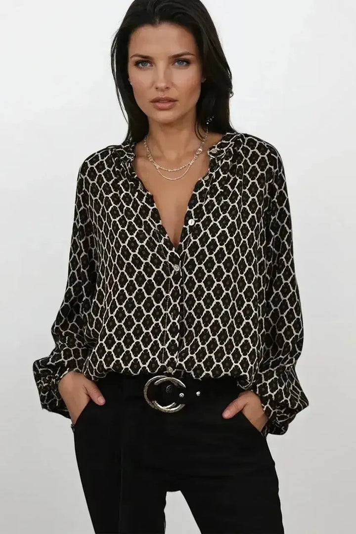 Top donna a maniche lunghe con scollo a V e fantasia geometrica, stile elegante e versatile, comfort quotidiano.