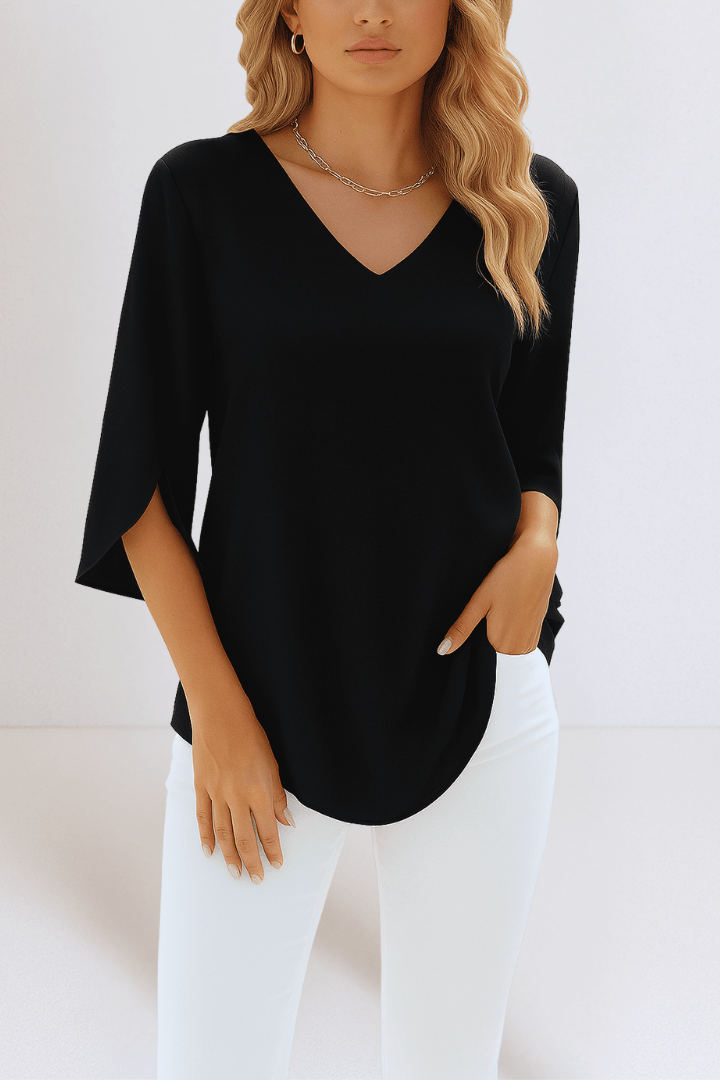 Blusa donna casual a maniche lunghe con scollo a V e dettaglio sulle maniche, comoda e versatile.