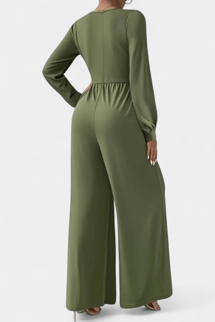 Splendida tuta elegante da donna con scollo a V, vita drappeggiata e gamba larga, ideale per serate speciali.