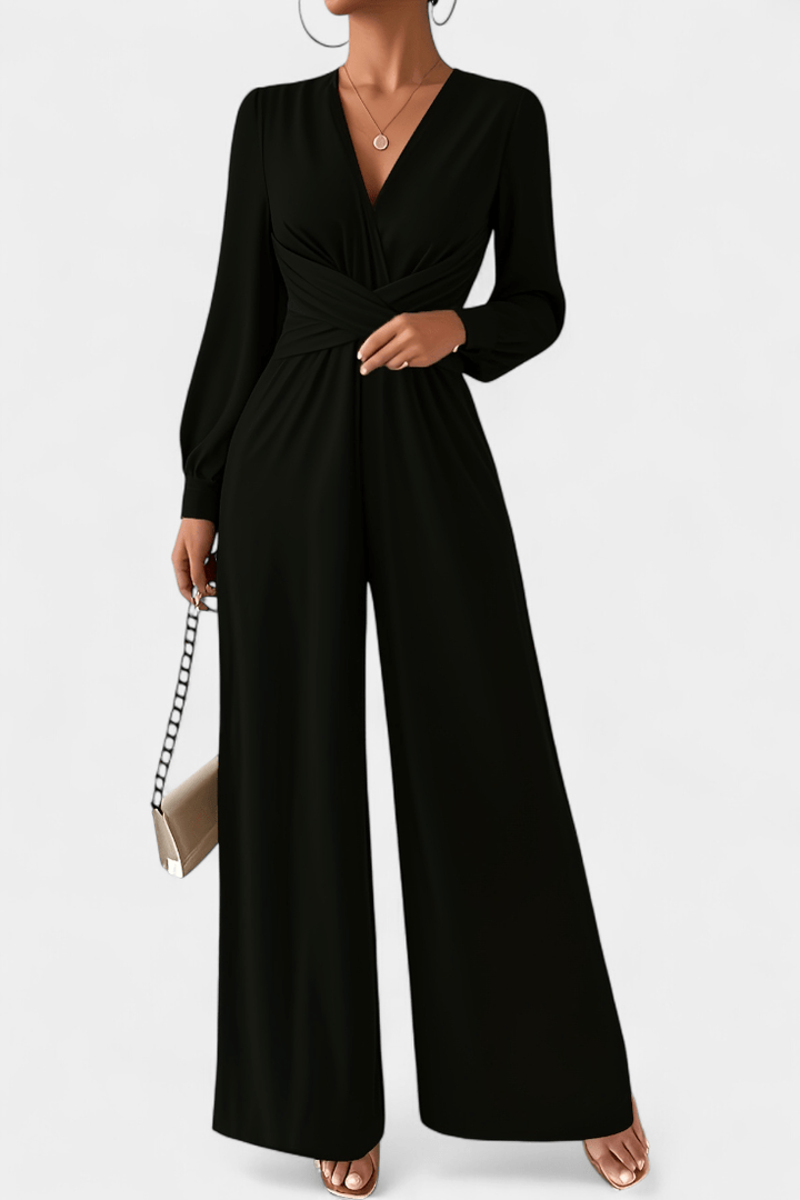 Tuta donna moda italiana: design elegante, scollo a V e vita drappeggiata con pantaloni ampi per un tocco chic.