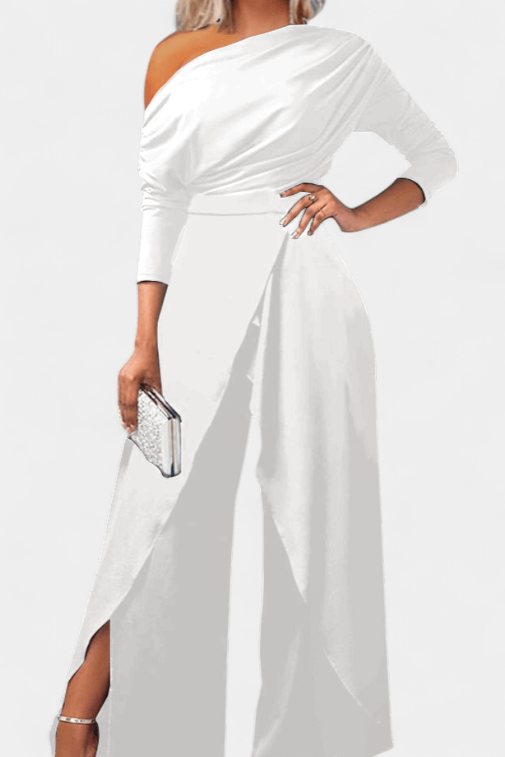 Tuta donna elegante con spalla scoperta nera e gamba larga, ideale per un outfit serale moderno e chic.