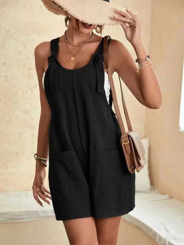 Playsuit estivo corto donna, con fiocco elegante e tasche laterali. Perfetto per outfit casual-romantici e relax.