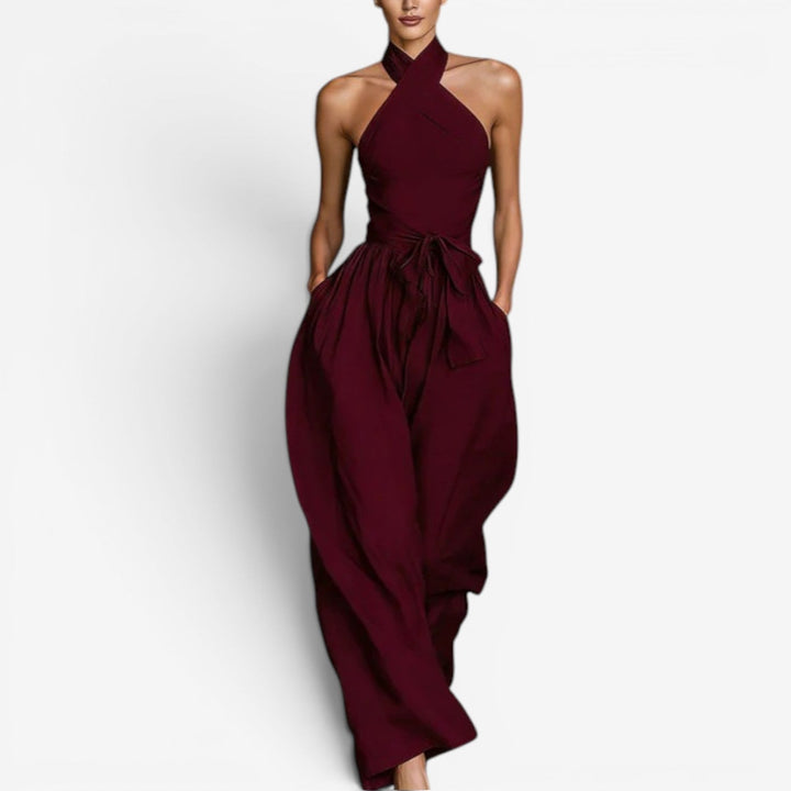 Chic tuta donna estiva versatile con scollo halter e schiena scoperta, per un abbigliamento serale alla moda.