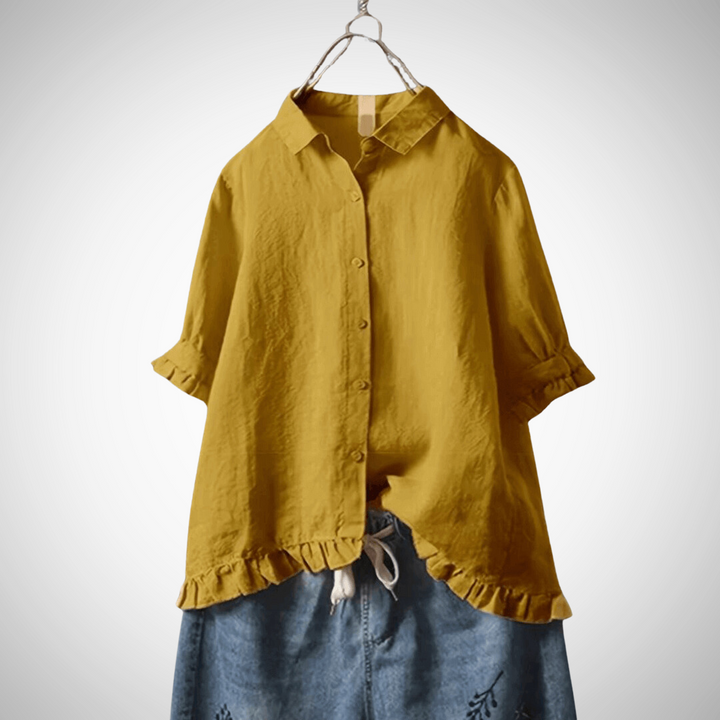 Camicia donna a maniche corte per l'estate. Realizzata in cotone, offre uno stile casual e una vestibilità comoda.