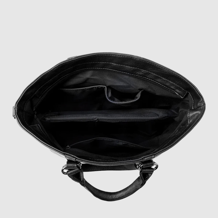 Borsetta in pelle da donna, design moderno con tre cinghioli per diverse portabilità, chic e versatile.