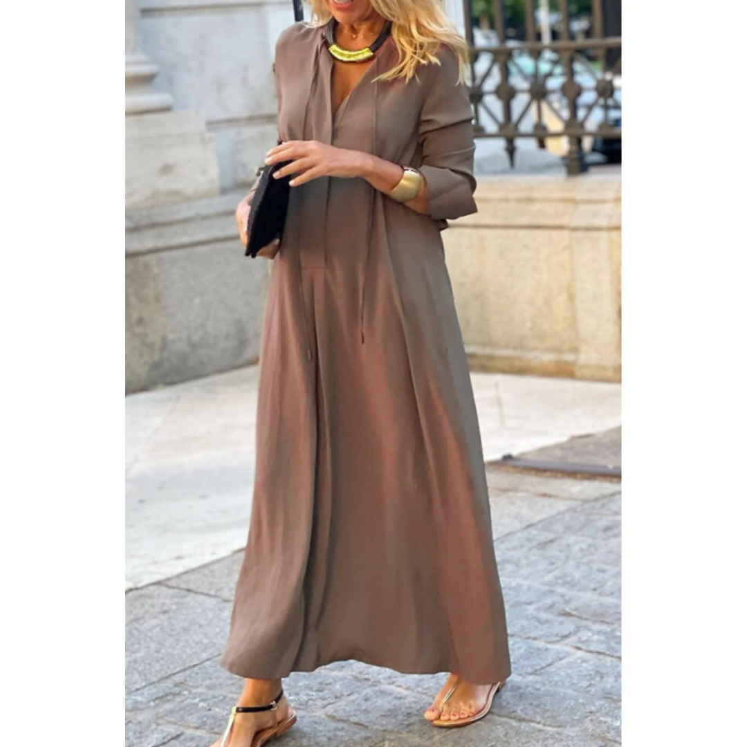 Abito donna lungo e fluido con maniche lunghe, scollo a V. Perfetto per un look elegante o casual chic, comodo.