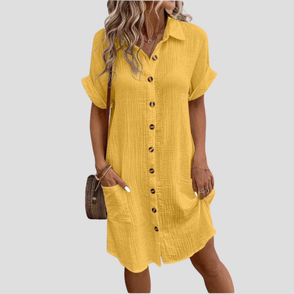 Abito camicia donna classico con colletto e bottoni, tasche laterali. Stile casual ed elegante per ogni giorno.