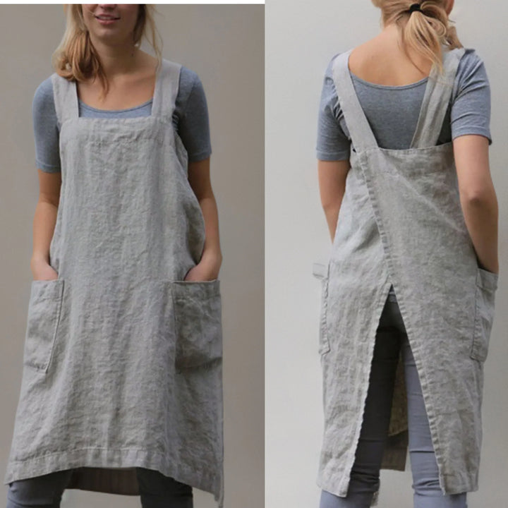 Abito grembiule da donna casual con tasche, comodo e versatile, ideale come vestito da giorno primaverile.
