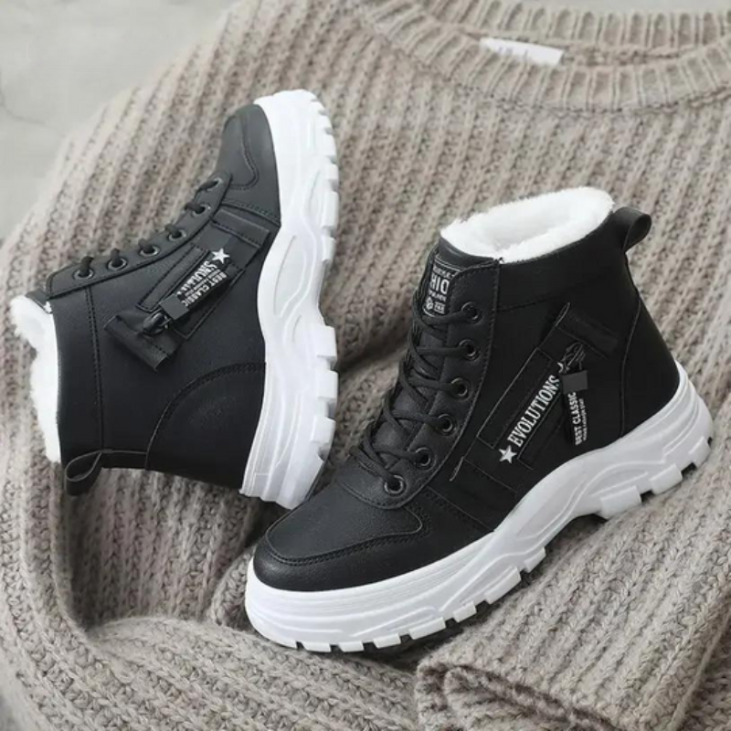 Stivaletti donna moda invernali, neri con lacci. Calzature eleganti e calde per il massimo comfort invernale.