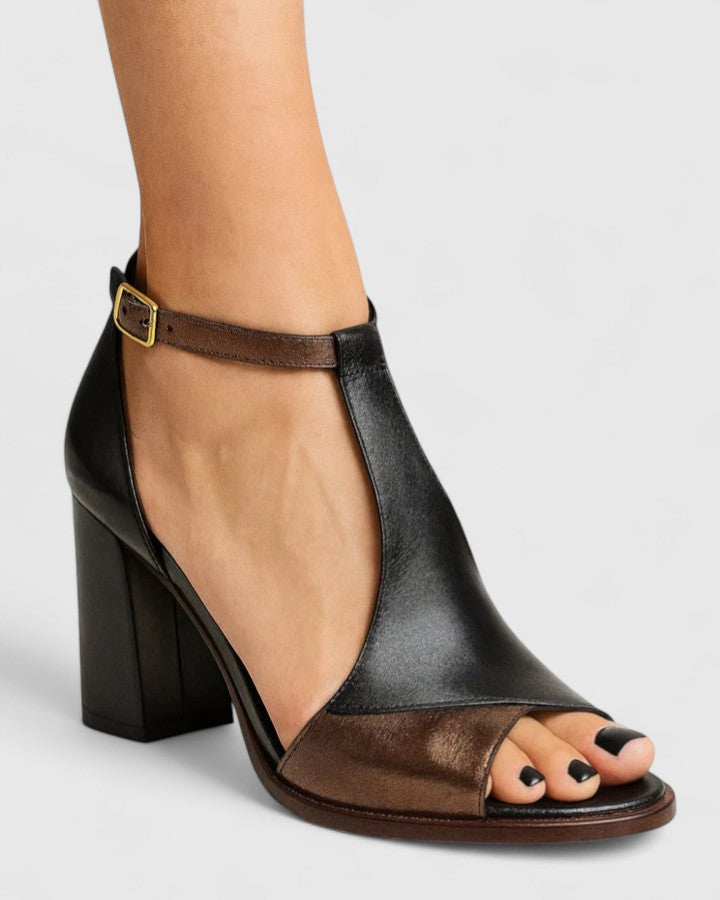 Scarpe décolleté nere da donna con cinturino, design moderno e tacco stabile. Ideali per ogni occasione.