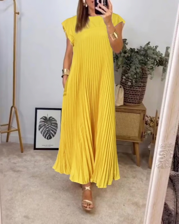 Vestito donna maxi plissettato, fluido e raffinato, ideale per eventi eleganti o come abito da cerimonia.