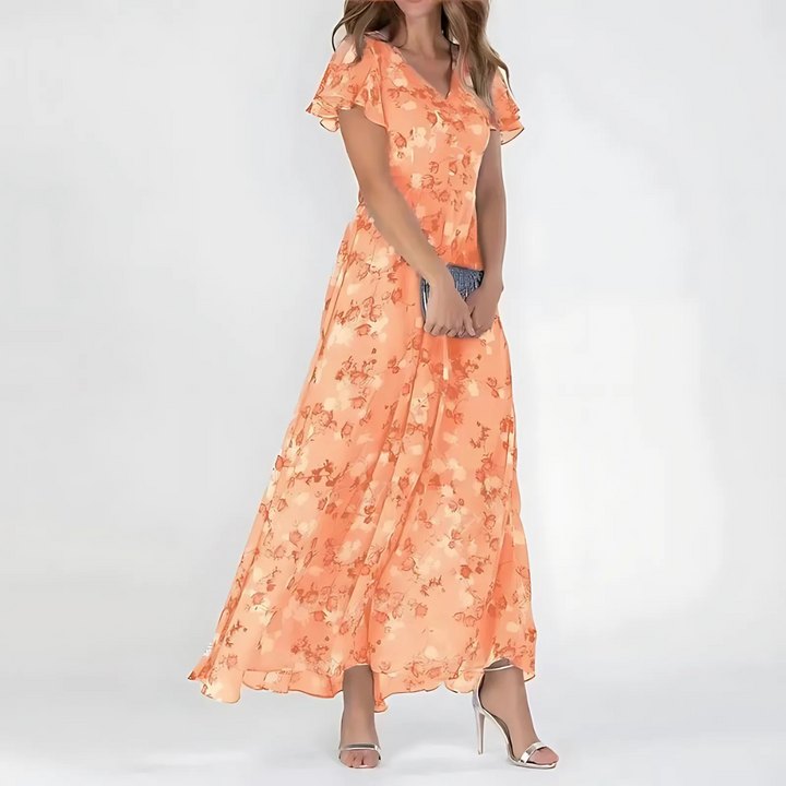 Elegante abito midi floreale svolazzante donna, ideale per cerimonie autunnali e ospite matrimonio chic.