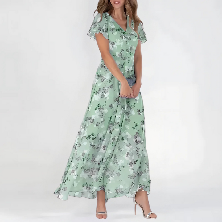 Abito midi floreale donna autunnale svolazzante. Ideale per eventi, cerimonie o look casual chic.