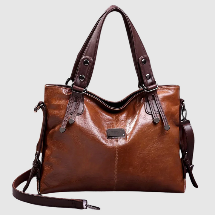 Borsa a mano da donna in pelle lucida, ideale per un'eleganza quotidiana. Accessorio moda di stile e qualità.