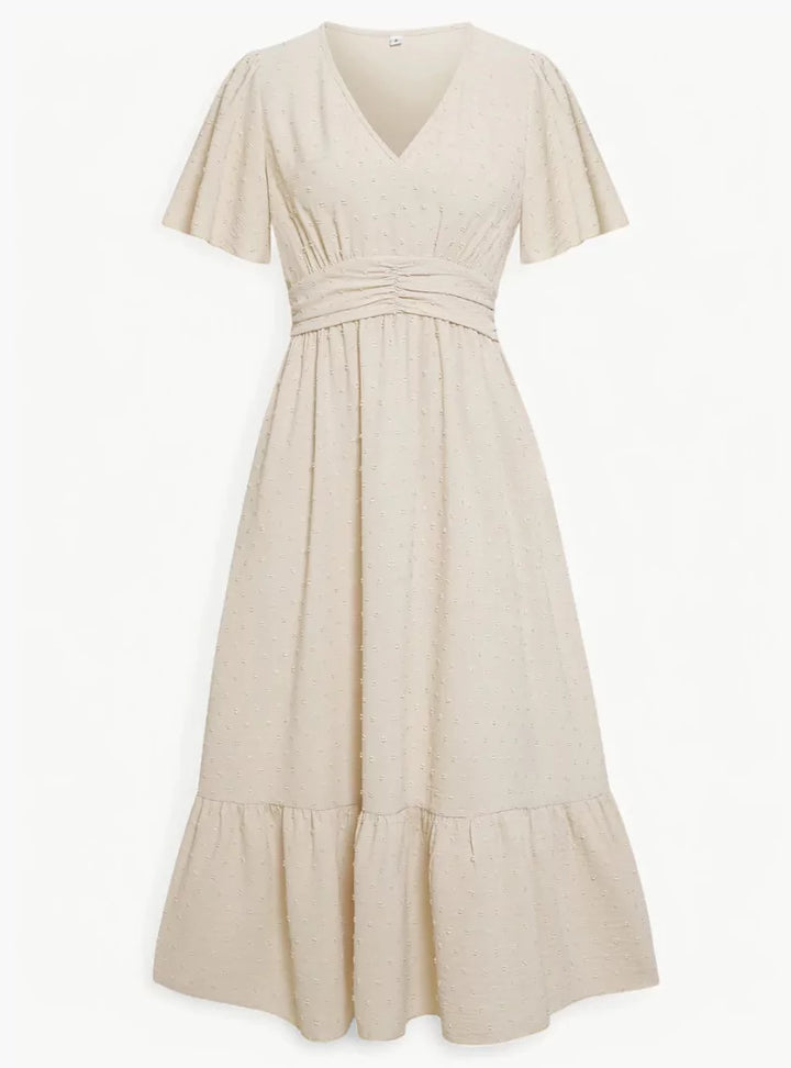 Abito midi donna fluido e comodo con scollo a V, perfetto per primavera estate e un look rilassato.
