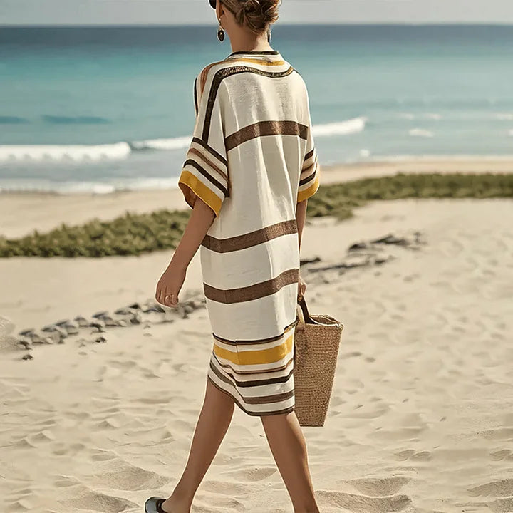 Abito a righe fluido da donna, vestito midi con scollo a V. Perfetto per un look estivo casual-chic.
