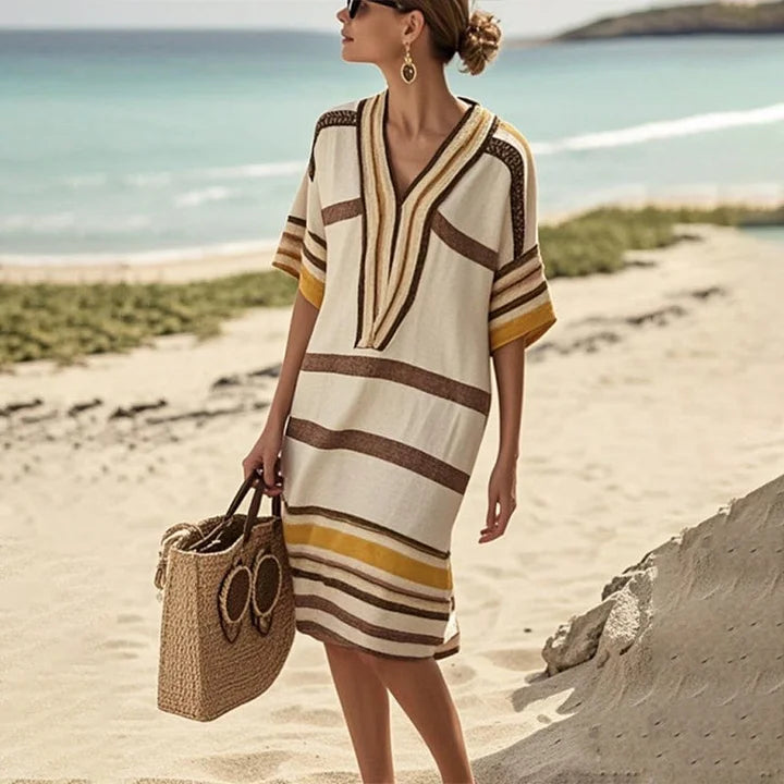 Abito midi a righe da donna con scollo a V, stile fluido casual. Perfetto per l'estate, elegante e versatile.
