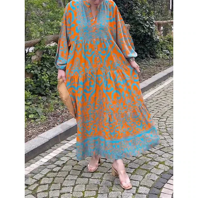 Elegante vestito lungo donna a balze con stampa etnica. Abito fluido bohemien ideale per la primavera estate.