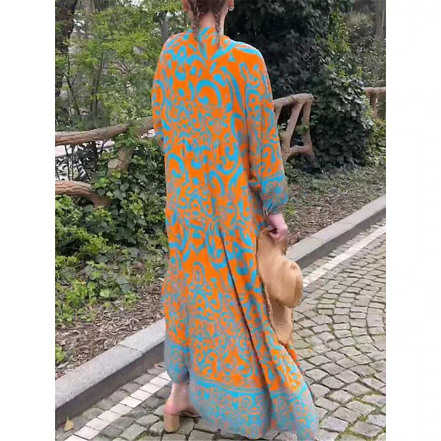 Vestito casual maxi donna con vivace stampa etnica albicocca. Abito fluido e bohemien, perfetto per ogni look.