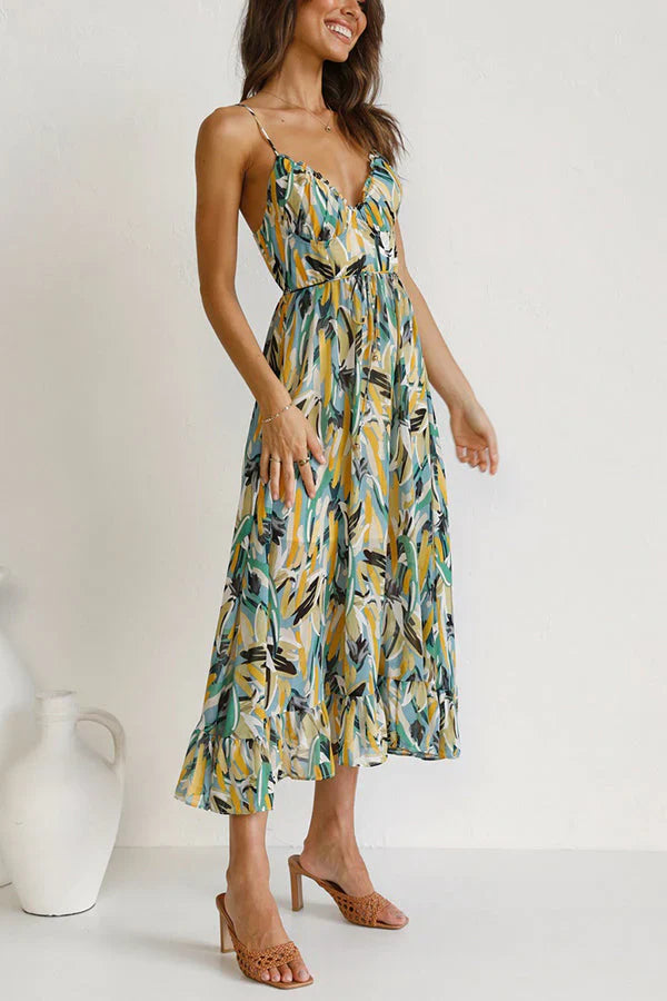 Outfit estivo: vestito donna midi giallo/verde, fantasia astratta e scollo a V per un look fluido e confortevole.