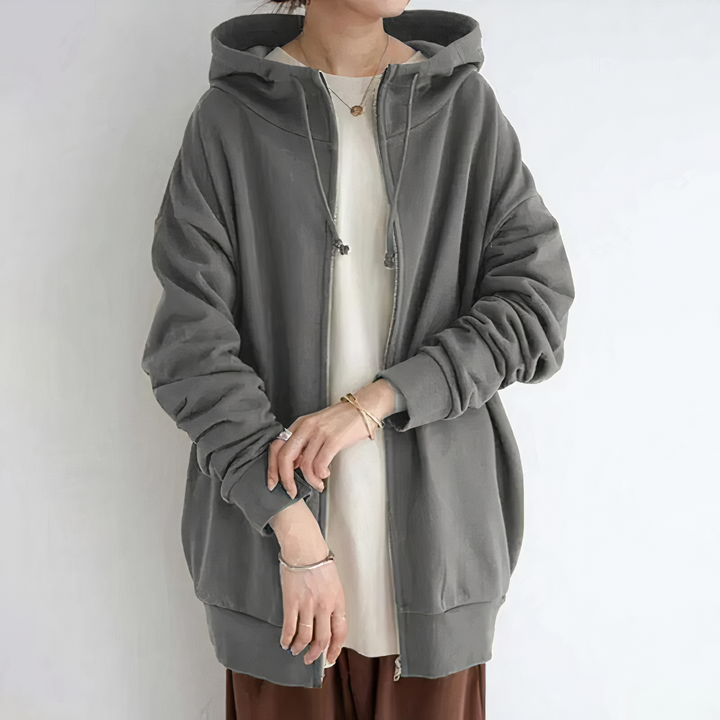 Felpa donna oversize calda con cappuccio e zip frontale per un look casual e comodo. Perfetta per l'inverno.