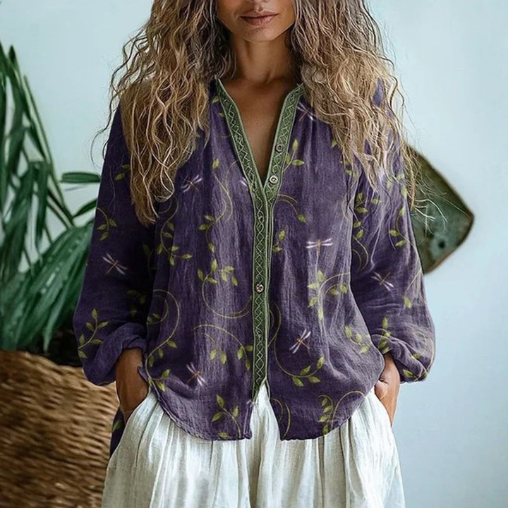 Blusa donna elegante a righe con bottoni e maniche lunghe, perfetta per ufficio o look casual chic.