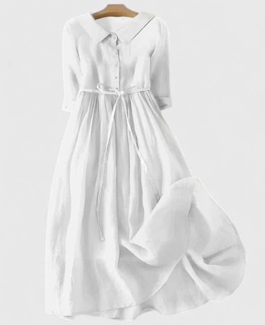 Vestito azzurro fluido per donna, ideale per occasioni di giorno e sera, un capo di moda estiva.