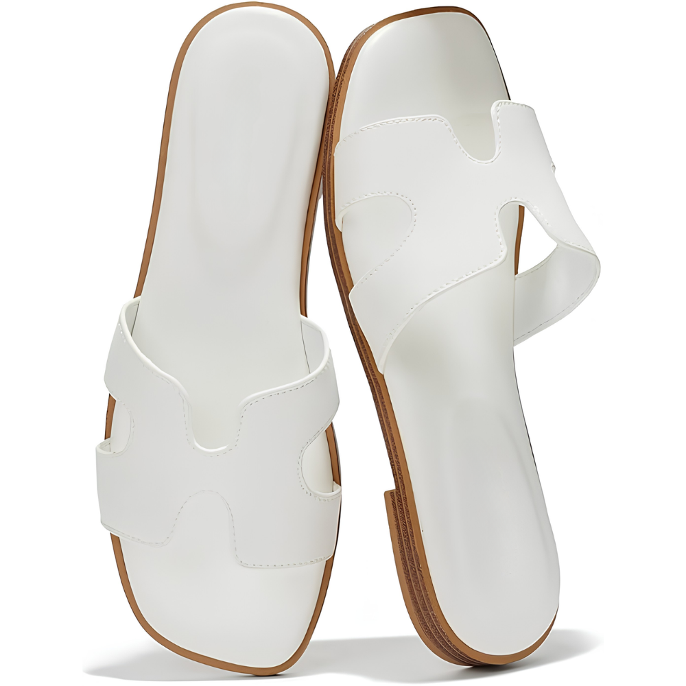 Profilo laterale sandali donna Tessa, con suola comoda e design elegante per calzature estive versatili.