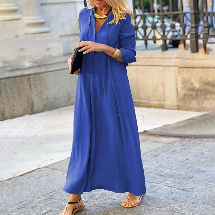 Elegante abito lungo donna con scollo a V e maniche lunghe. Un capo versatile e comodo per la moda femminile.