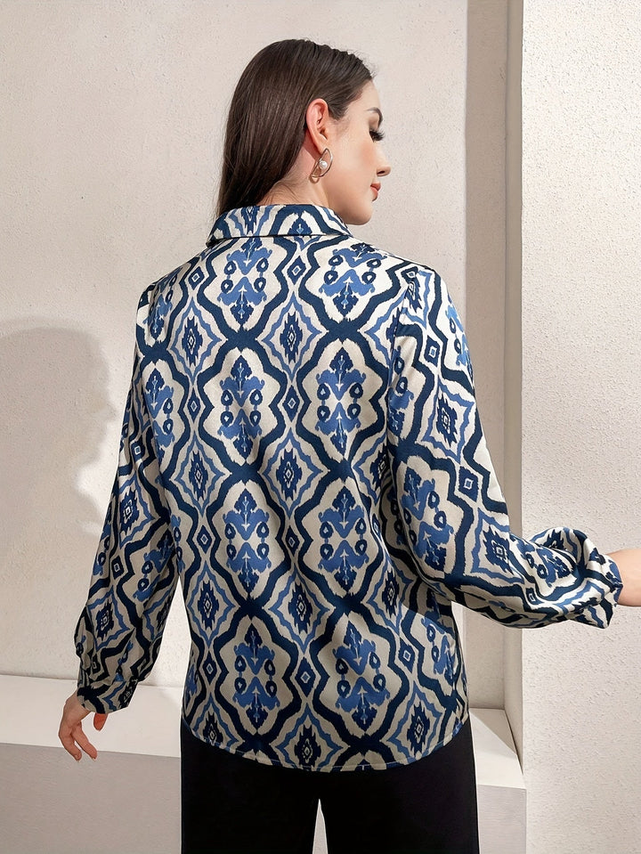 Blusa femminile primavera estate a manica lunga, con stampa grafica vivace per un look moderno e chic quotidiano.
