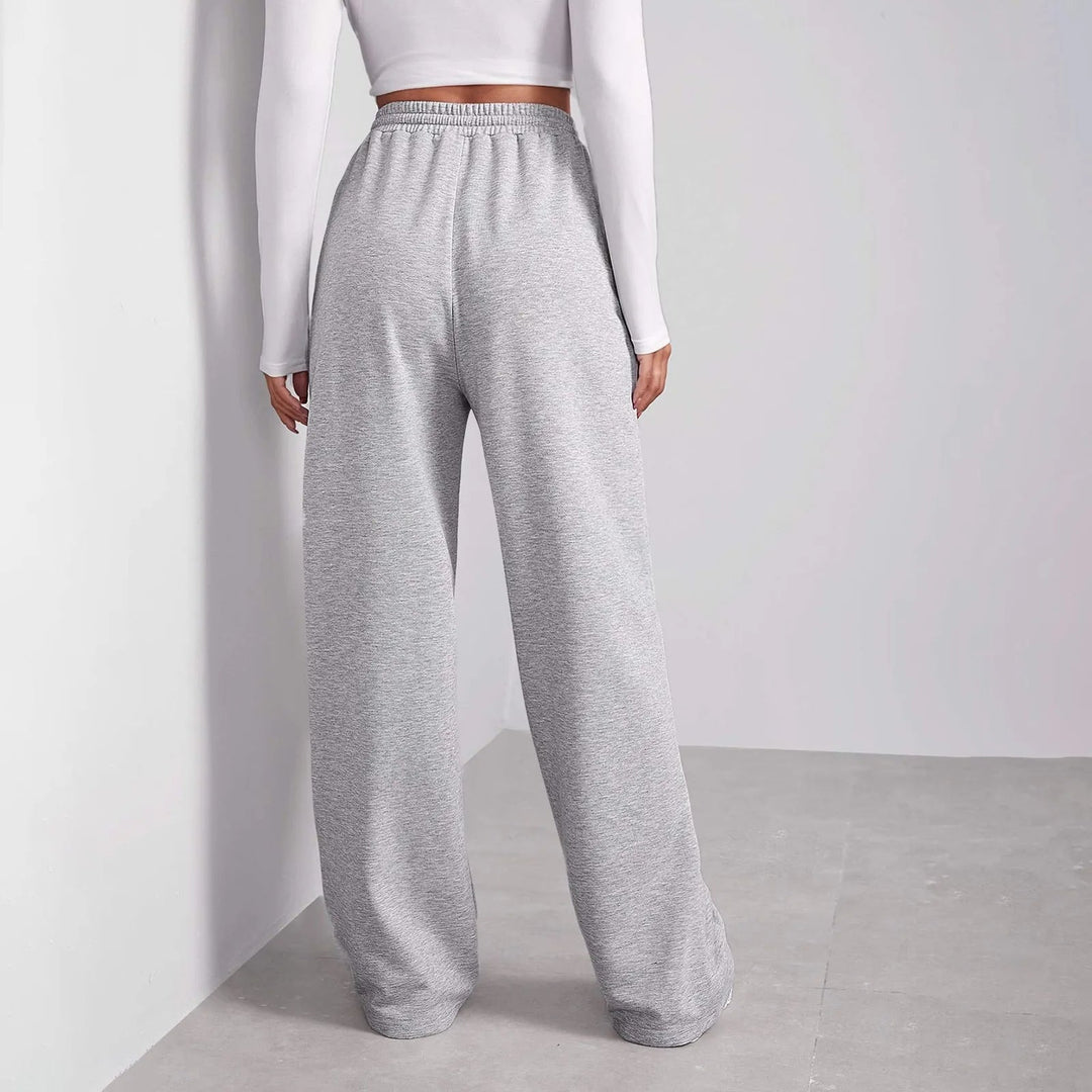 Pantaloni grigio scuro donna a gamba dritta, design versatile per look eleganti o casual.