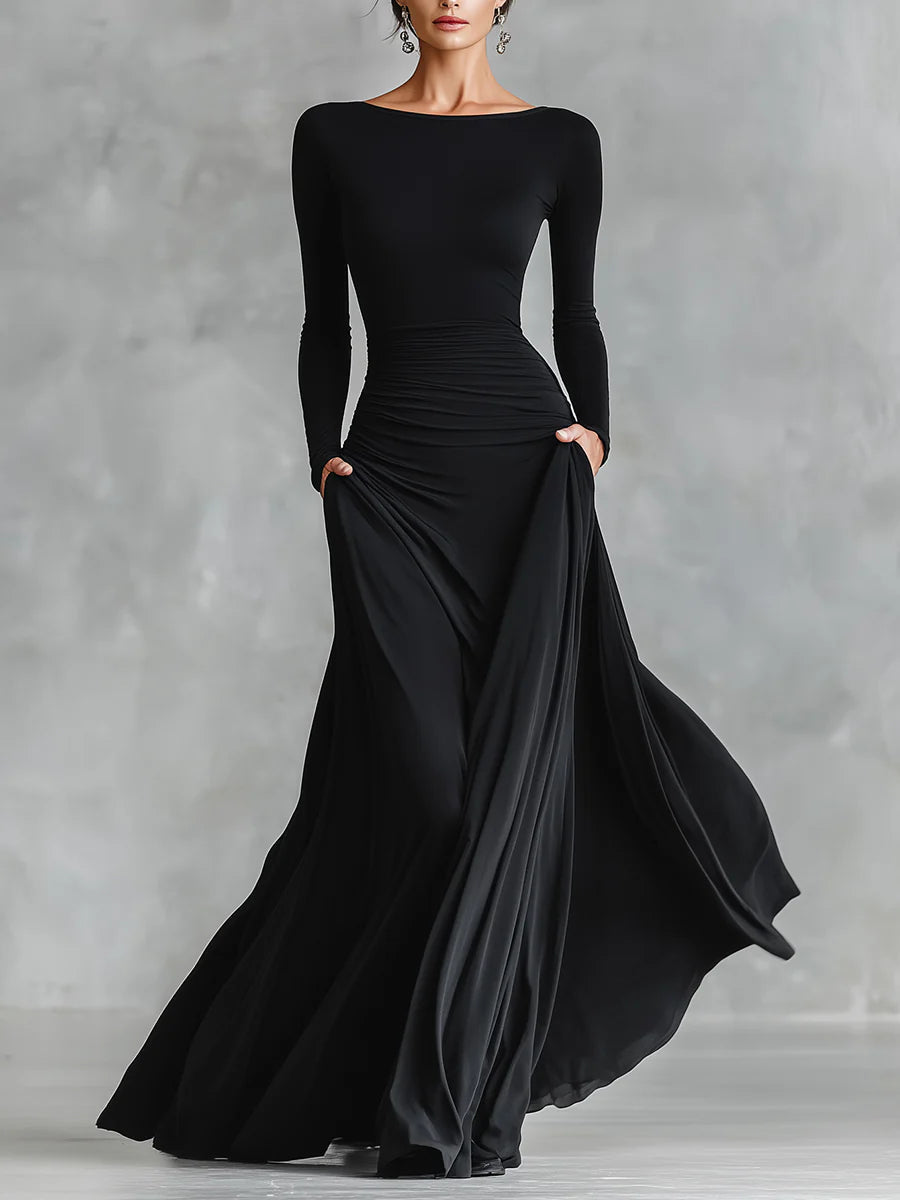 Abito lungo donna nero elegante, scollo a barca e maniche lunghe, perfetto per serate e occasioni formali.