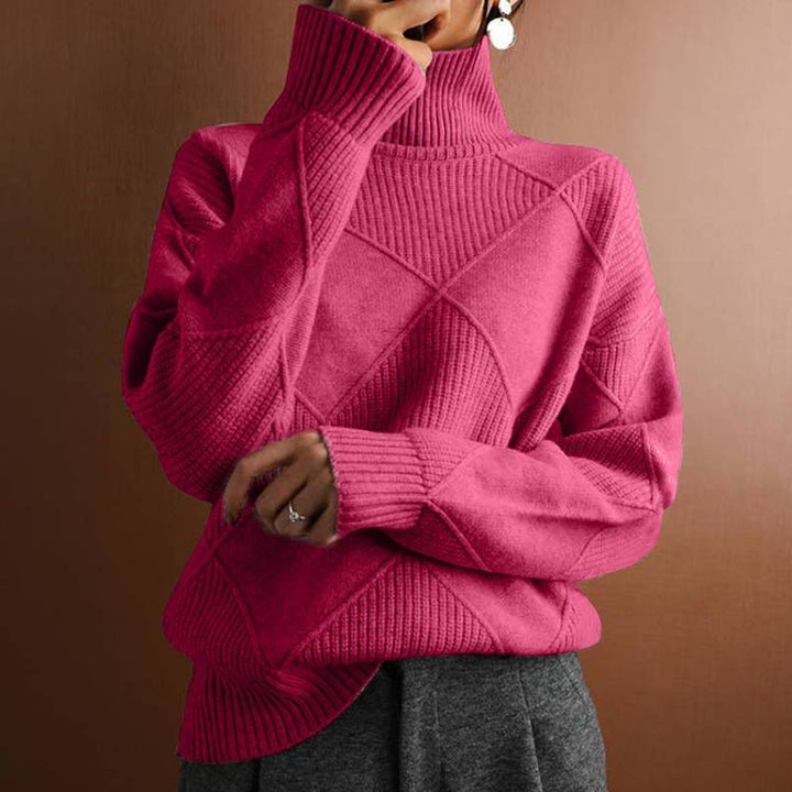 Maglione donna a rombi con collo alto, silhouette rilassata. Ideale per un comfort quotidiano con eleganza.