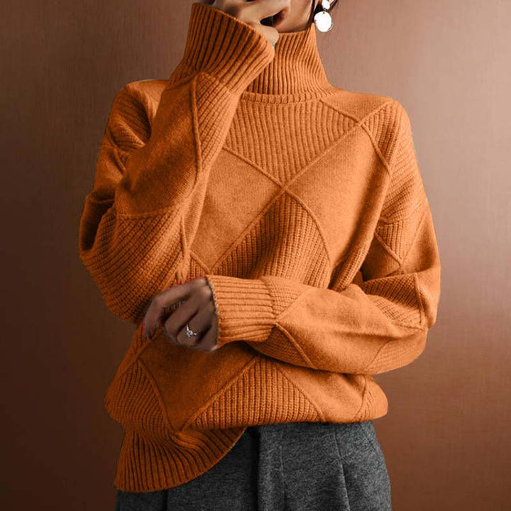 Maglione elegante donna a rombi, collo alto. Combinazione di colori vivaci per un tocco di stile unico.