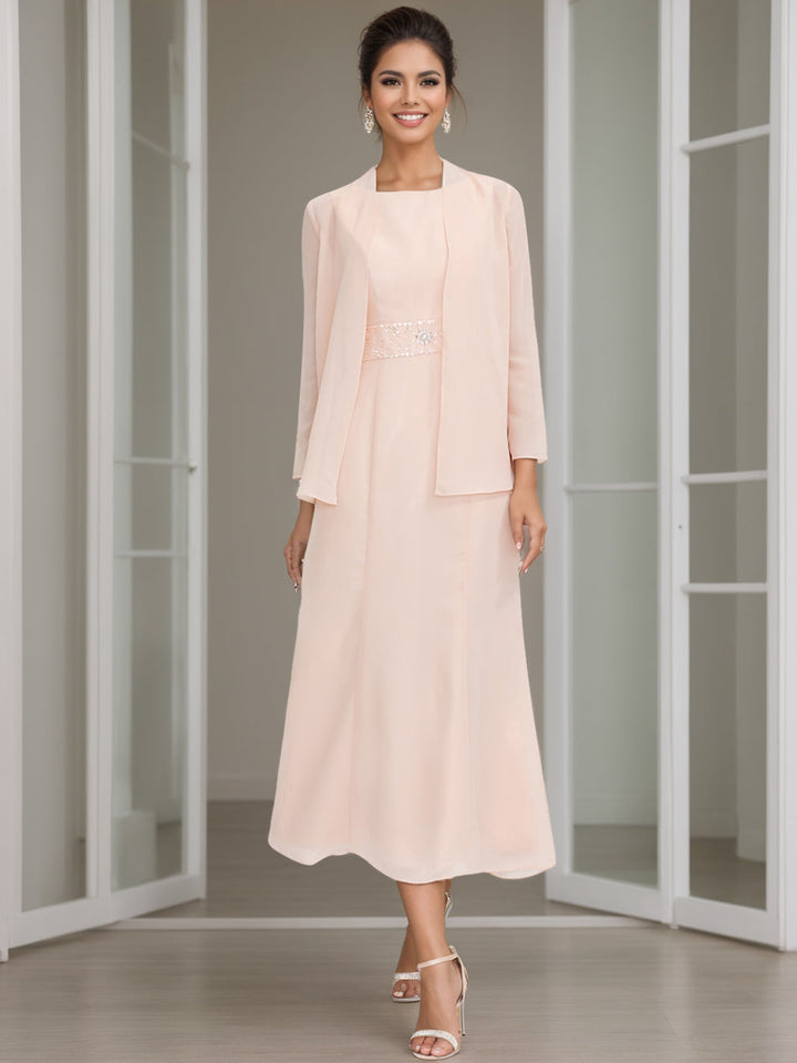 Abito formale donna elegante con giacca impreziosita, ideale per matrimoni e cerimonie.