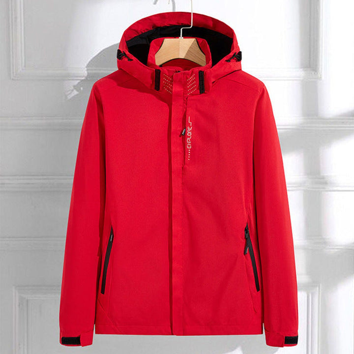Giacca casual da donna rossa con cappuccio e comode tasche zip. Antivento, perfetta per attività all'aperto.