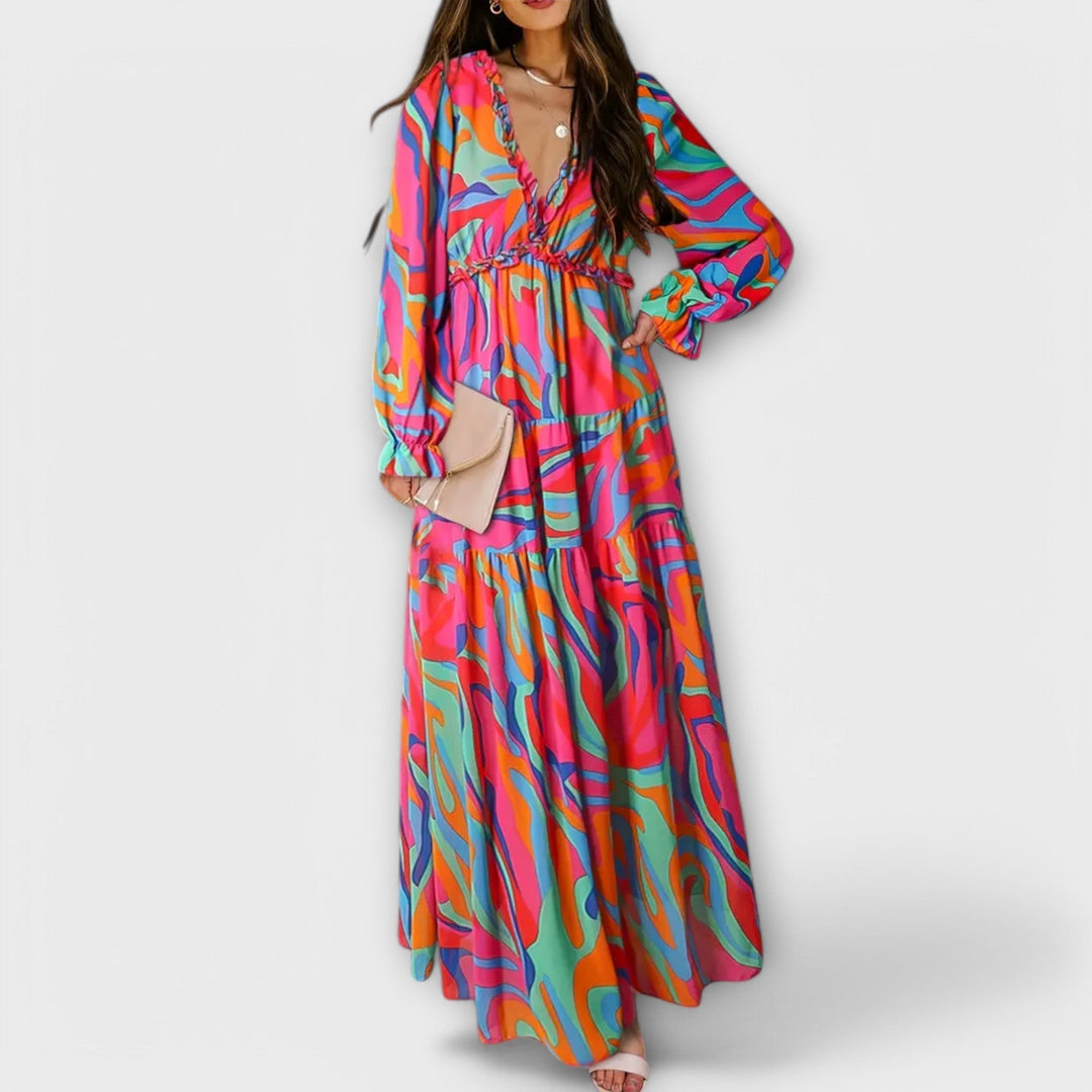 Leggero abito maxi floreale da donna con maniche lunghe, look primaverile ed estivo, comodo e chic.