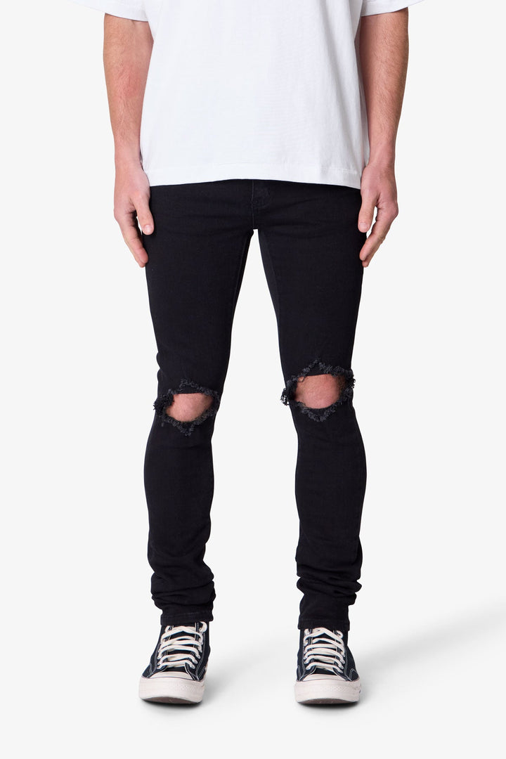 Denim jeans neri skinny da uomo, con sfumature e vestibilità aderente per un look maschile moderno.