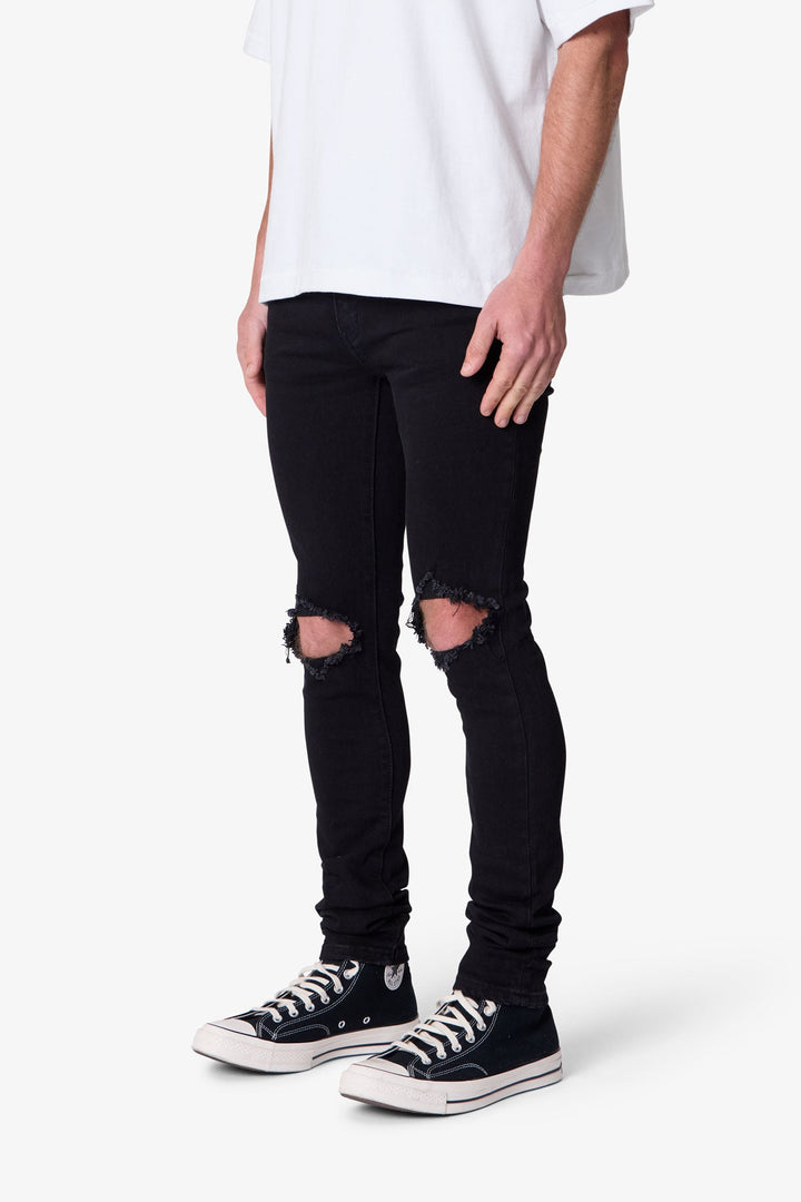 Jeans uomo neri skinny con effetto sfumato, perfetti per un outfit casual e alla moda maschile.